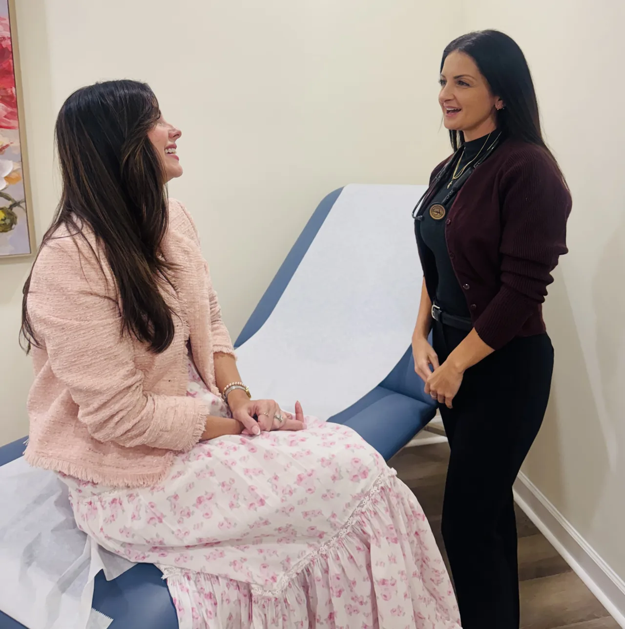 OptumMD patient care A patient talking with a clinician at OptumMD